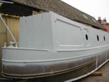 Semi-Trad stern, showing hull sear - the upward sweep of the deck toward the stern of the boat. CLICK for a bigger picture